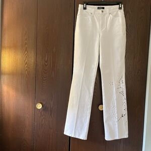 Cambio white denim jeans with see through cutouts on one leg. Size 2